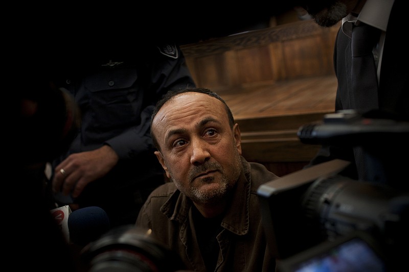 
              FILE - In this Jan. 25, 2012, file photo, senior Fatah leader Marwan Barghouti appears at Jerusalem's court. Israel's Prison Service released footage on Sunday, May 7, 2017, that it says shows Barghouti, the leader of a mass Palestinian hunger strike, breaking his fast, a claim dismissed by the Palestinians as an attempt to undermine the open-ended strike, now in its 21st day. (AP Photo/Bernat Armangue, File)
            