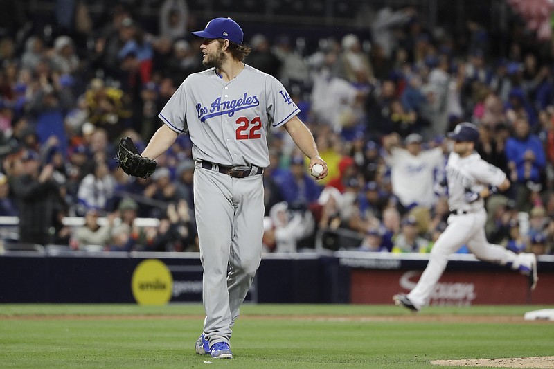 
              Los Angeles Dodgers starting pitcher Clayton Kershaw (22) reacts as San Diego Padres' Ryan Schimpf rounds the bases after hitting a home run eighth inning of a baseball game Saturday, May 6, 2017, in San Diego. (AP Photo/Gregory Bull)
            