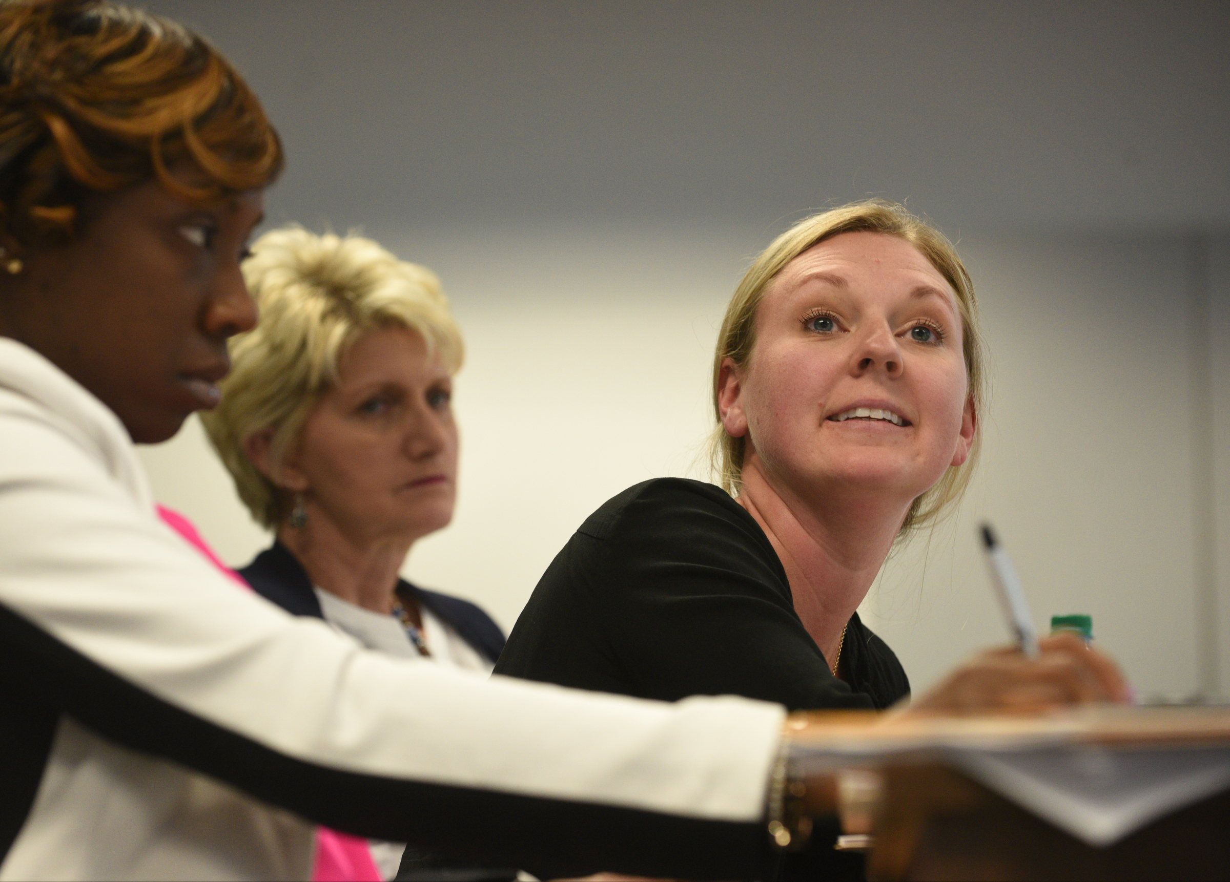 School board member Tiffanie Robinson, right, asks a question as other board members, Karitsa Mosley Jones, left, and Rhonda Thurman, listen to superintendent candidate Stuart Greenberg speak Monday, May 8, 2017 in the superintendent's conference room.