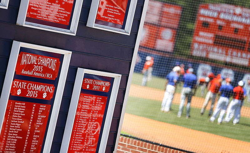 
              Plaques mark the accomplishments of the Parkview High School baseball team as they warm up before a baseball game in Lilburn, Ga., on Wednesday, April 26, 2017. Across the U.S., perhaps nowhere is student-on-student sexual assault as dismissed or as camouflaged as in boys' sports, an Associated Press investigation found. Older Parkview players in 2015 were disciplined for sexual battery, in part, after attacking younger teammates, but the district called it "inappropriate physical contact" and "misbehavior." (AP Photo/John Bazemore)
            