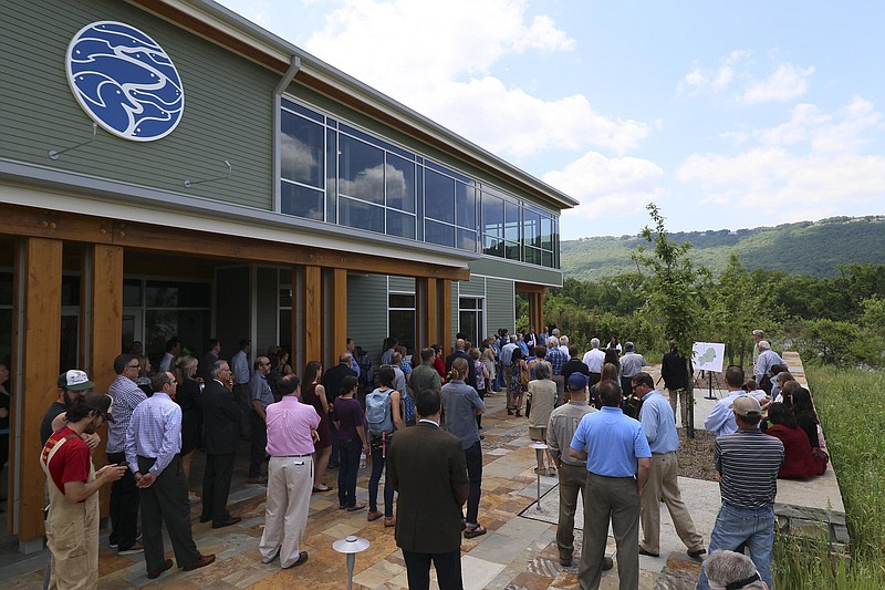 Staff Photo by Dan Henry / The Chattanooga Times Free Press- 5/9/17. Bridgett Massengill, president of Thrive 2055 Regional Partnership, speaks to a large crowd at the Tennessee Aquarium Conservation Institute on Tuesday, May 9, 2017 before unveiling a map detailing information about the region's vision for natural resource preservation. 