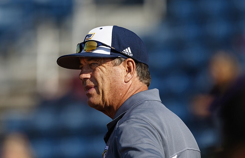 UTC head softball coach Frank Reed talks to players during the Mocs' home softball game against Furman at Frost Stadium on Friday, March 25, 2016, in Chattanooga, Tenn.