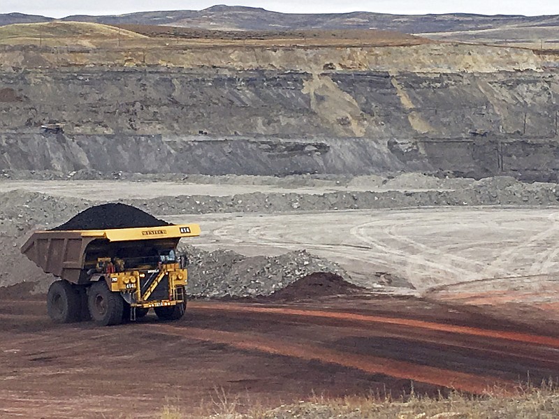 
              FILE - In this March 28, 2017, file photo, a dump truck hauls coal at Contura Energy's Eagle Butte Mine near Gillette, Wyo. Four U.S. states filed a lawsuit Tuesday, May 9, 2017, over President Donald Trump's decision to restart the sale of coal leases on federal lands, saying the Obama-era block of the leasing program was reversed without studying what's best for the environment and for taxpayers. (AP Photo/Mead Gruver, File)
            