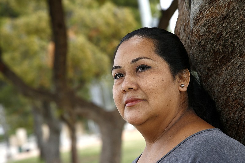 
              Blanca Chico, an uninsured patient, uses Planned Parenthood Arizona to get her health services pauses in a nearby park near to where she lives on Tuesday, May 9, 2017, in Scottsdale, Ariz.  Republican lawmakers in Arizona and Iowa took steps to join a growing list of states that have acted to curtail public funding for Planned Parenthood, which is the leading provider of abortions in the U.S. but also provides a range of other health services that would be affected by the funding cuts. 
 (AP Photo/Ross D. Franklin)
            