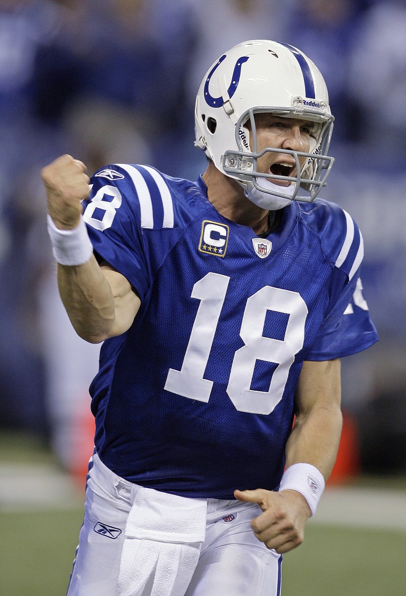 
              FILE - In this Nov. 15, 2009, file photo, Indianapolis Colts quarterback Peyton Manning reacts after he threw a touchdown pass to Reggie Wayne during the fourth quarter of an NFL football game against the New England Patriots in Indianapolis.  Peyton Manning will become the first Indianapolis Colts player to have his jersey retired during a two-day celebration of his career this fall. The weekend begins with the unveiling of Manning's statue outside Lucas Oil Stadium on Oct. 7, and concludes the following day when he is inducted into the team's Ring of Honor and becomes the seventh player in franchise history with a retired number. (AP Photo/Darron Cummings, File)
            