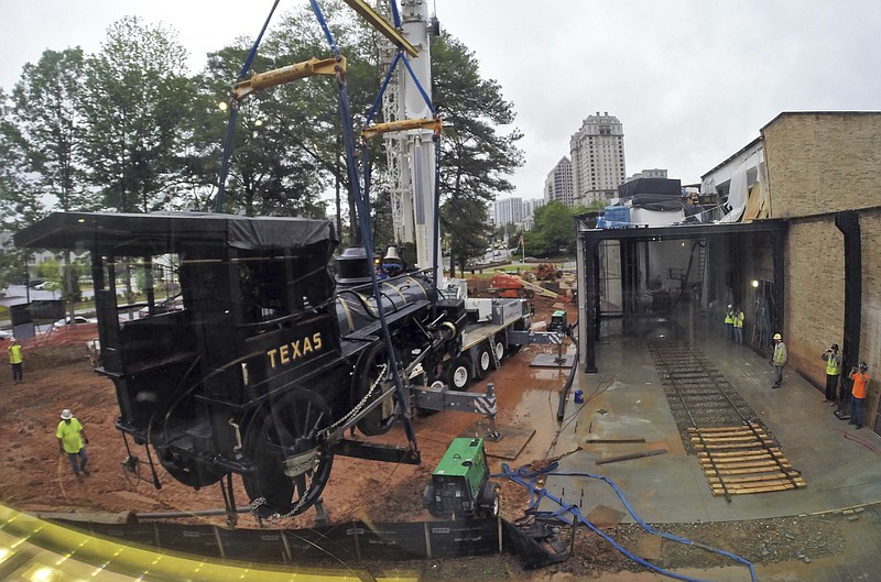 
              In a May 4, 2017 photo, the 26-ton Texas, the famed engine from the 1862 Great Locomotive Chase during the Civil War, arrives at the Atlanta History Center in Atlanta. The Texas returned to the Atlanta History Center after a trip to North Carolina for refurbishing. The Texas will go on exhibit in September in Atlanta. (Bob Andres/Atlanta Journal-Constitution via AP)
            