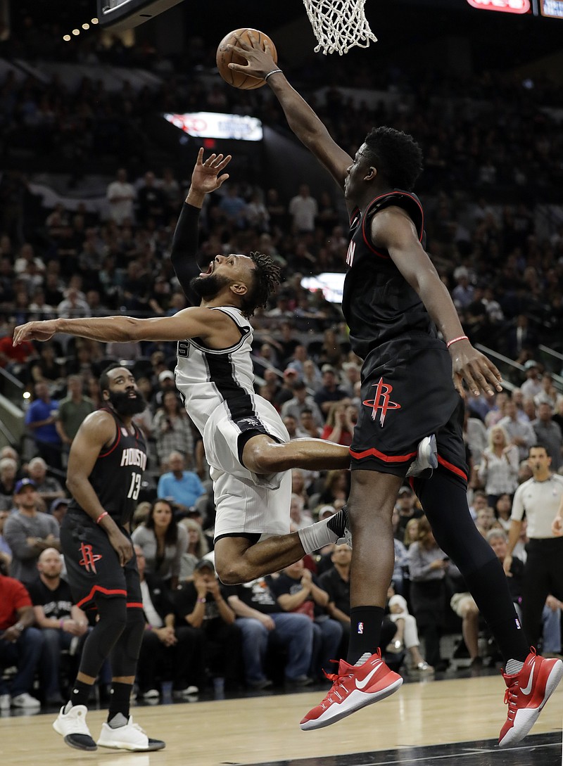 
              San Antonio Spurs guard Patty Mills (8) has his shot blocked by Houston Rockets' Clint Capela, right, during the second half in Game 5 of an NBA basketball second-round playoff series, Tuesday, May 9, 2017, in San Antonio. (AP Photo/Eric Gay)
            