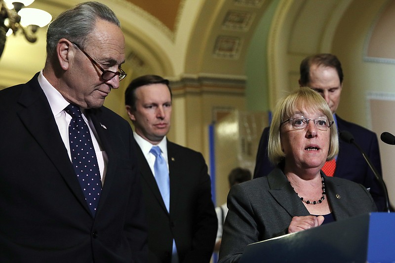 
              Sen. Patty Murray, D-Wash., second from right, accompanied by, from left, Senate Minority Leader Charles Schumer of N.Y., left, Sen. Chris Murphy, D-Conn., and Sen. Ron Wyden, D-Ore., speaks to the media on Capitol Hill in Washington, Tuesday, May 9, 2017, following a policy luncheon. (AP Photo/Jacquelyn Martin)
            