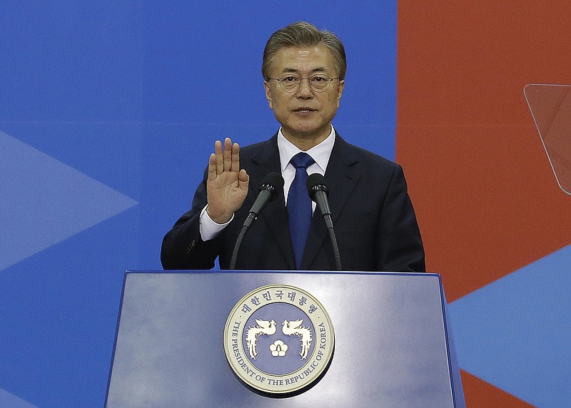 
              South Korean President Moon Jae-in takes an oath during his inauguration ceremony at the National Assembly in Seoul, Wednesday, May 10, 2017. (AP Photo/Ahn Young-joon. Pool)
            