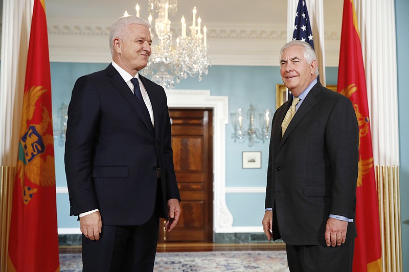 
              "We shall see," said Secretary of State Rex Tillerson, right, in answer to a question about if US Russia relations were improving, during a meeting with Montenegro's Prime Minister Dusko Markovic Monday, May 8, 2017, at the State Department in Washington. Tillerson will meet with his Russian counterpart about the Syria crisis amid a new Russia-led push to create safe zones to lower violence. The State Department and Russia's Foreign Ministry say that Tillerson and Russian Foreign Minister Sergey Lavrov will meet in Washington Wednesday, May 10, 2017. (AP Photo/Jacquelyn Martin)
            