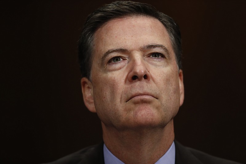 In this May 3, 2017, file photo, FBI Director James Comey listens on Capitol Hill in Washington. President Donald Trump has fired Comey. In a statement on Tuesday, May 9, Trump says Comey's firing "will mark a new beginning" for the FBI. (AP Photo/Carolyn Kaster, File)