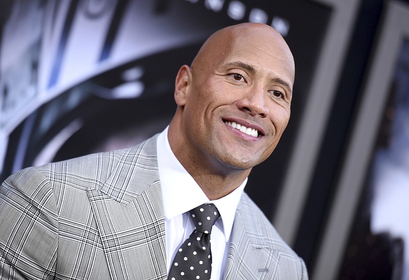 In this May 26, 2015, file photo, Dwayne Johnson arrives at the premiere of "San Andreas" at the TCL Chinese Theatre in Los Angeles. Johnson told GQ for a story published May 10, 2017, that he is seriously considering a run for president. (Photo by Richard Shotwell/Invision/AP, File)