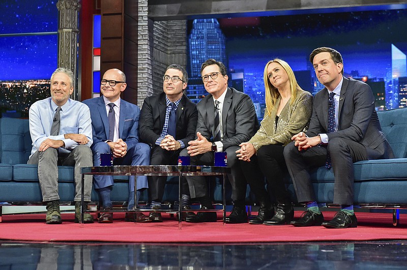 
              In this photo provided by CBS, host Stephen Colbert, third from right, sits with guests, from left, Jon Stewart, Rob Corddry, John Oliver, Samantha Bee, and Ed Helms during "The Late Show with Stephen Colbert," on Tuesday, May 9, 2017, in New York. It was a rare TV reunion Tuesday as Colbert played host to a gang of his fellow “Daily Show” alums on a special edition of CBS’ “The Late Show.” (Scott Kowalchyk/CBS via AP)
            