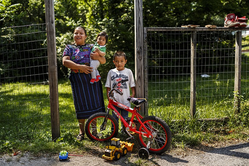 Basilia is photographed with her children Yahir, her oldest, and Danilo near her home on Wednesday, May 10, 2017, in Chattanooga, Tenn. Basila immigrated to the United States from Guatemala with her son to escape gang violence.