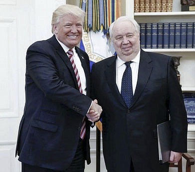 President Donald Trump shakes hands with Russian Ambassador Sergey Kislyak on Wednesday., but back in March he ignored the opportunity to extend that same courtesy to American ally and German Chancellor Angela Merkel. Russian Embassy Photo