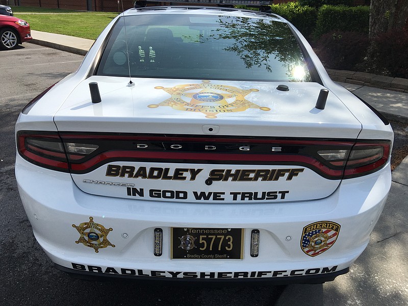 A Bradley County Sheriff's Office vehicle displays a new "In God we trust" decal.
