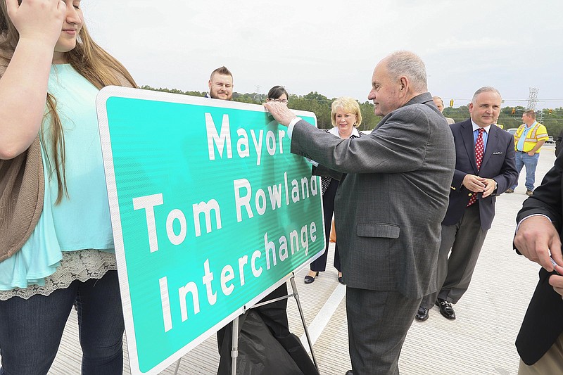 Staff Photo by Dan Henry / The Chattanooga Times Free Press- 5/12/17. Cleveland Mayor Tom Roland signs a road sign during the grand opening of the new Tom Rowland Interchange in Cleveland, Tenn., on May 12, 2017. 