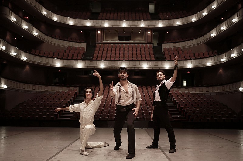 
              In this March 30, 2017 photo, Egyptian longtime friends and ballet co-stars Ahmed Nabil, left, Hani Hassan, center, and Mohammed Hamed, pose on stage after a performance of "Zorba," at the Cairo Opera House, in Egypt. The national ballet company is rebuilding after years of political turmoil and economic pain. Ballet may be an elite Western art, it may be far removed from Egyptian society, which has grown more religiously conservative and xenophobic. But it’s still a powerful passion for the Egyptians who dance it and watch it. (AP Photo/Nariman El-Mofty)
            