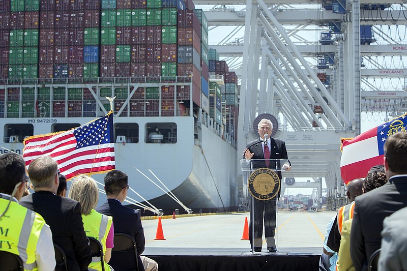 
              In this photo provided by the Georgia Port Authority, Georgia Gov. Nathan Deal speaks in front of the container ship COSCO Development at the Port of Savannah, Friday, May 12, 2017, in Garden City, Ga. The ship is the largest vessel ever to call on the U.S. East Coast. (AP Photo/Georgia Port Authority, Stephen Morton)
            