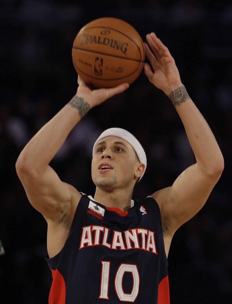 
              FILE - In this Feb. 14, 2009, file photo, Atlanta Hawks' Mike Bibby takes a shot in the 3-point event during the NBA All-Star Weekend basketball in Phoenix. UNLV announced Saturday, May 13, 2017, that the 39-year-old basketball great has now earned a bachelor of arts degree in multidisciplinary studies from the College of Liberal Arts. The point guard was a standout when he helped Arizona win the 1997 NCAA championship. (AP Photo/Matt York, File)
            