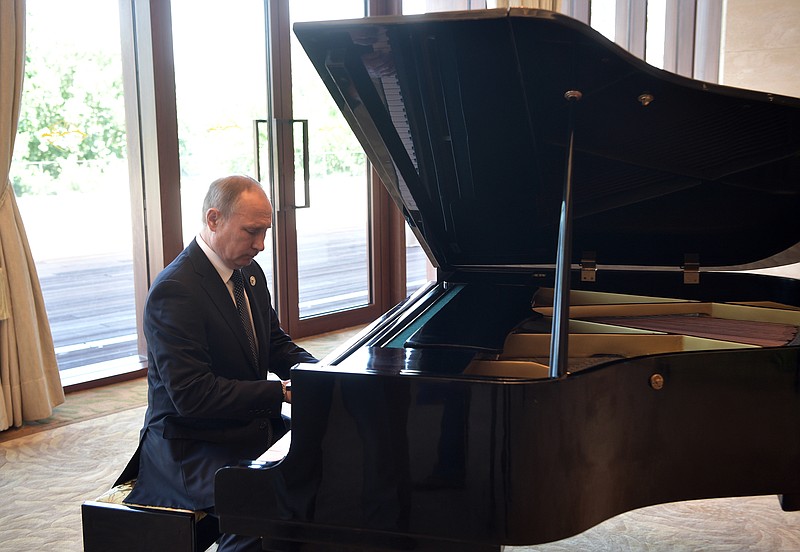 
              Russian President Vladimir Putin plays piano before his talks with Chinese President Xi Jinping prior to the opening ceremony of the Belt and Road Forum in Beijing, Sunday, May 14, 2017. (Alexei Nikolsky, Sputnik, Kremlin Pool Photo via AP)
            