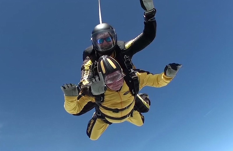 
              In this grab taken from video, Verdun Hayes gestures as he tandem skydiving, in Devon, England, Sunday, May 14, 2017. A 101-year-old D-Day veteran has broken the world record for the oldest tandem skydiver. Hayes, a great-grandfather, jumped out of a plane from 15-thousand feet in Devon, UK, on Sunday accompanied by four generations of his family. (Skydive.buzz via AP)
            