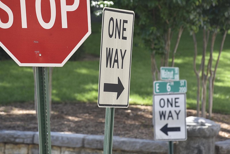 One-way signs direct motorists at the corner of Walnut and 6th streets.  The Chattanooga City Council will decide at its meeting tonight whether to spend about $70,000 to study doing away with one-way streets in downtown.  
