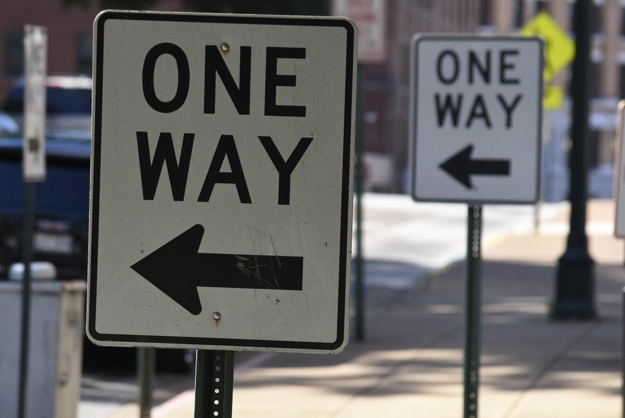 One-way signs direct motorists at the corner of Walnut and 6th streets. The Chattanooga City Council will decide at its meeting tonight whether to spend about $70,000 to study doing away with one-way streets in downtown.