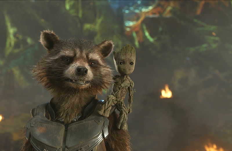 
              This image released by Disney shows the Rocket, voiced by Bradley Cooper, left, and Groot, voiced by Vin Diesel in a scene from Marvel's "Guardians Of The Galaxy Vol. 2."  (Marvel Studios/Disney via AP)
            