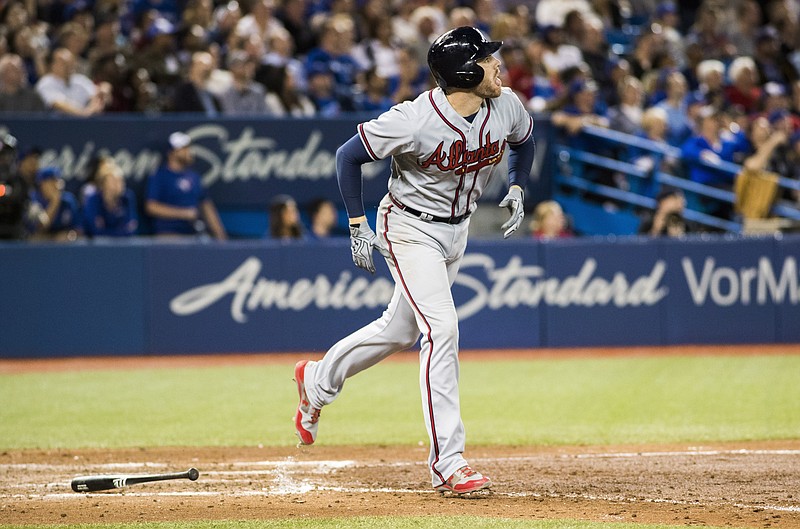 Atlanta Braves' Freddie Freeman hits a three-run home run against the Toronto Blue Jays during the sixth inning of a baseball game in Toronto, Monday May 15, 2017. (Mark Blinch/The Canadian Press via AP)