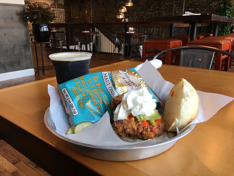 Fried chicken breast sandwich drizzled with house-made buffalo sauce, topped with celery salad and whipped buttermilk dressing.