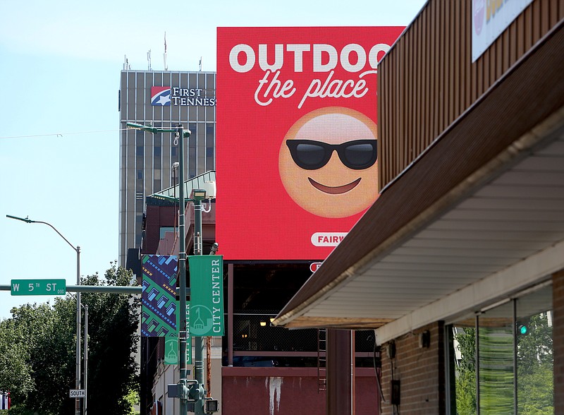 A new billboard decorates the corner of Market Street and 5th Street in downtown Chattanooga, Tenn., on Tuesday, May 16, 2016. The billboard rotates through several advertisements over the course of a few minutes.