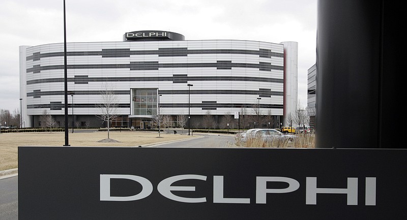 
              FILE - In this March 22, 2006, file photo, Delphi's World Headquarters is shown in Troy, Mich. Automotive parts and electronics maker Delphi Corp. is the latest partner to join BMW, Intel and Mobileye to develop autonomous vehicles. The companies announced Tuesday, May 16, 2017, that Delphi will work with the companies to integrate autonomous driving systems. They plan to have a self-driving system ready by 2021. (AP Photo/Carlos Osorio, File)
            