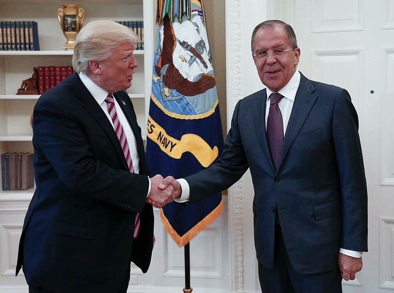 
              This handout photo released by the Russian Ministry of Foreign Affairs, shows President Donald Trump meeting with Russian Foreign Minister Sergey Lavrov in the Oval Office of the White House in Washington, Wednesday, May 10, 2017. The Washington Post is reporting that Trump revealed highly classified information about Islamic State militants to Russian officials during a meeting at the White House last week. The newspaper cites current and former U.S. officials who say Trump jeopardized a critical source of intelligence on IS in his conversations with the Russian foreign minister and the Russian ambassador to the U.S. They say Trump offered details about an IS terror threat related to the use of laptop computers on aircraft.(Russian Foreign Ministry via AP)
            