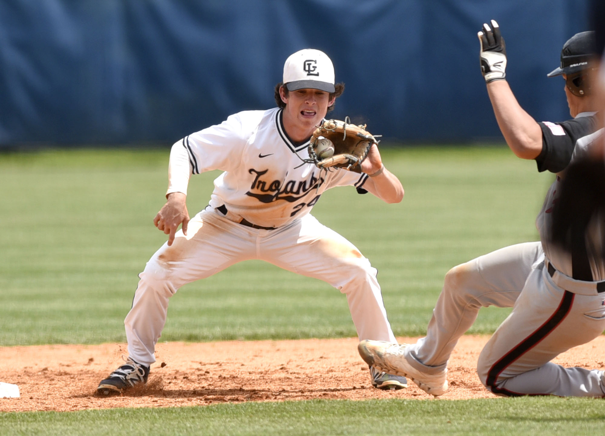 Gordon Lee 2nd baseman Kobie Cowan (24) takes the throw and prepares to tag out Charlton County's Austin Knowles (11) who was attempted the steal. The Charlton County Indians visited the Gordon Lee Trojans in the Georgia State Baseball Tournament Semifinals on May 17, 2017.