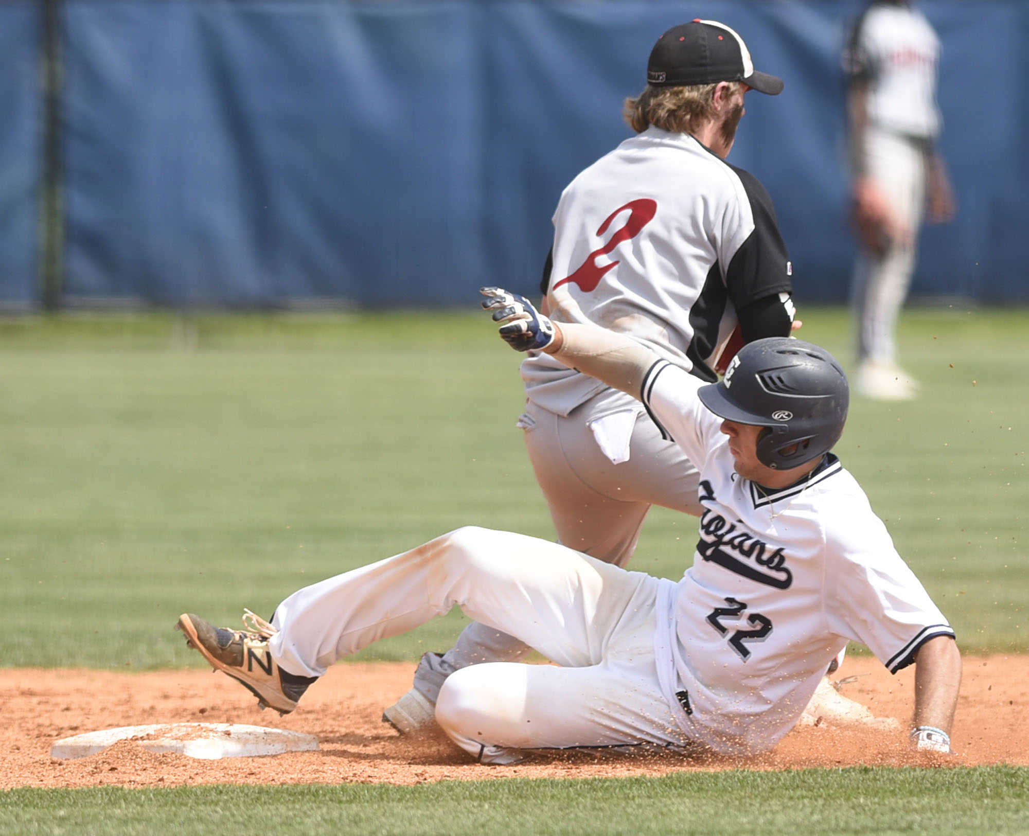 Gordon Lee's Dylan Minghini (22) slides into second with a double. The Charlton County Indians visited the Gordon Lee Trojans in the Georgia State Baseball Tournament Semifinals on May 17, 2017.
