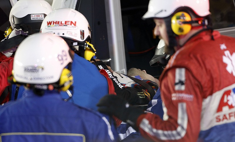 NASCAR driver Aric Almirola is loaded into an ambulance after a crash during last Saturday's Cup Series race at Kansas Speedway. He suffered a fractured vertebra and is out indefinitely.