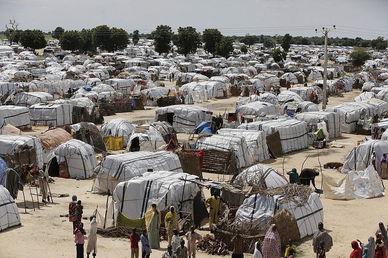 
              FILE- This Sunday Aug. 28, 2016 file photo shows a general view of one of the biggest camp for people displaced by Islamist Extremist in Maiduguri, Nigeria. Camps for thousands of people displaced by Boko Haram will have to stay open beyond the end of this month as Nigeria's military continues to fight the extremists in so-called liberated areas, officials say. The governor of the northern state of Borno, Kashim Shettima, told reporters on Tuesday, May 16, 2017 that it is not yet safe to return people to their homes in many places across the region. ( AP Photo/Sunday Alamba, File)
            