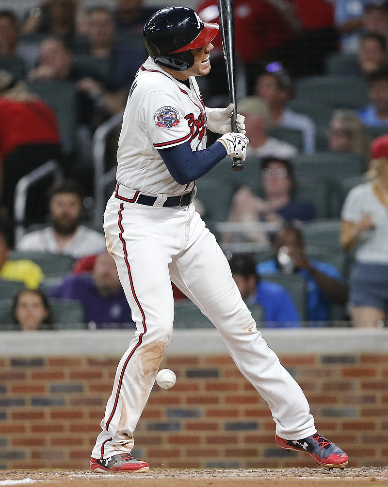 
              Atlanta Braves' Freddie Freeman reacts after being hit by a pitch during the fifth inning of a baseball game against the Toronto Blue Jays on Wednesday, May 17, 2017, in Atlanta. Freeman left the game. The Braves won 8-4. (AP Photo/John Bazemore)
            