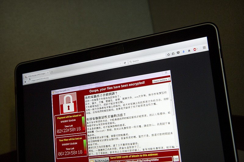 
              FILE - In this May 13, 2017, file photo, a screenshot of the warning screen from a purported ransomware attack, as captured by a computer user in Taiwan, is seen on a laptop in Beijing. As danger from the global cyberattack continues to fade, analysts are starting to assess the damage. The good news: Hard-hit organizations such as the U.K.’s National Health Service appear to be bouncing back, and few people seem to have actually paid the ransom. The bad: This attack has demonstrated how a new automated form of malware can spread rapidly, potentially encouraging future hackers. (AP Photo/Mark Schiefelbein, File)
            