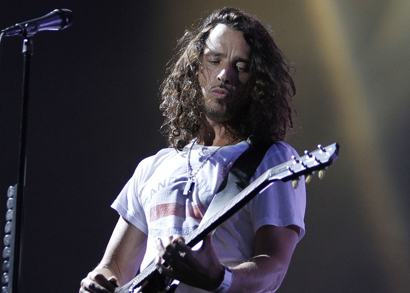 
              FILE - In this Sunday, Aug. 8, 2010, file photo, musician Chris Cornell of Soundgarden performs during the Lollapalooza music festival in Grant Park in Chicago. According to his representative, rocker Chris Cornell, who gained fame as the lead singer of Soundgarden and later Audioslave, has died Wednesday night in Detroit at age 52. (AP Photo/Nam Y. Huh, File)
            