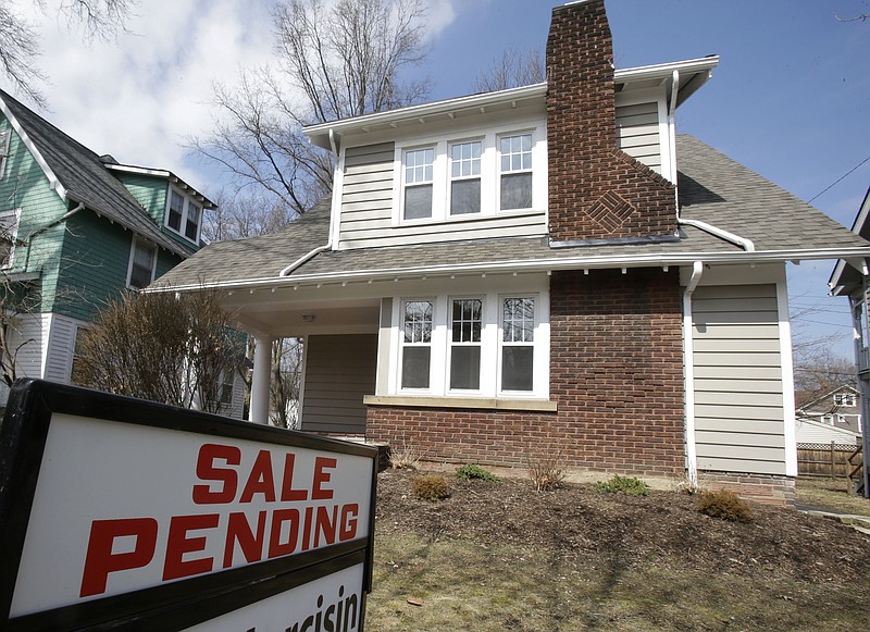 FILE - This Friday, March 21, 2014 file photo shows a home for sale in Cleveland Heights, Ohio. The National Association of Realtors releases pending home sales index for September 2014 on Monday, Oct. 27, 2014. (AP Photo/Tony Dejak, File)