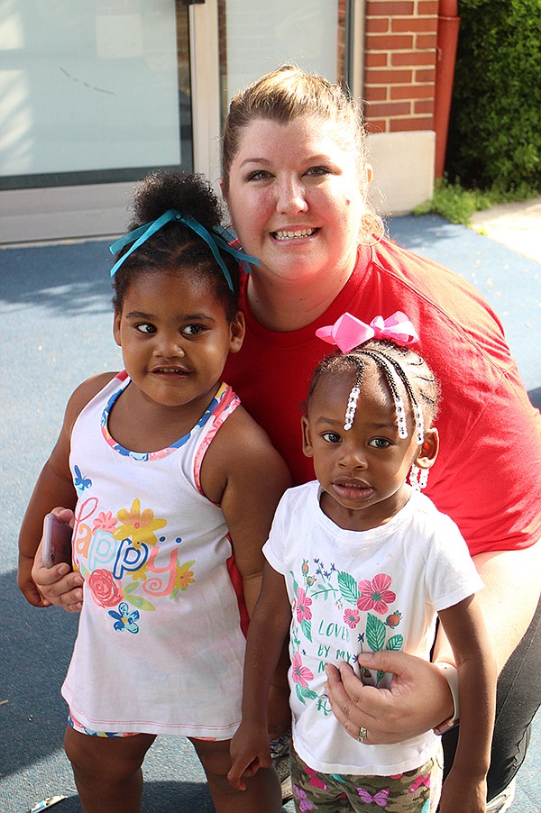 Christina Lane took a brief break from working to have her picture made with Naomi and Emoree.