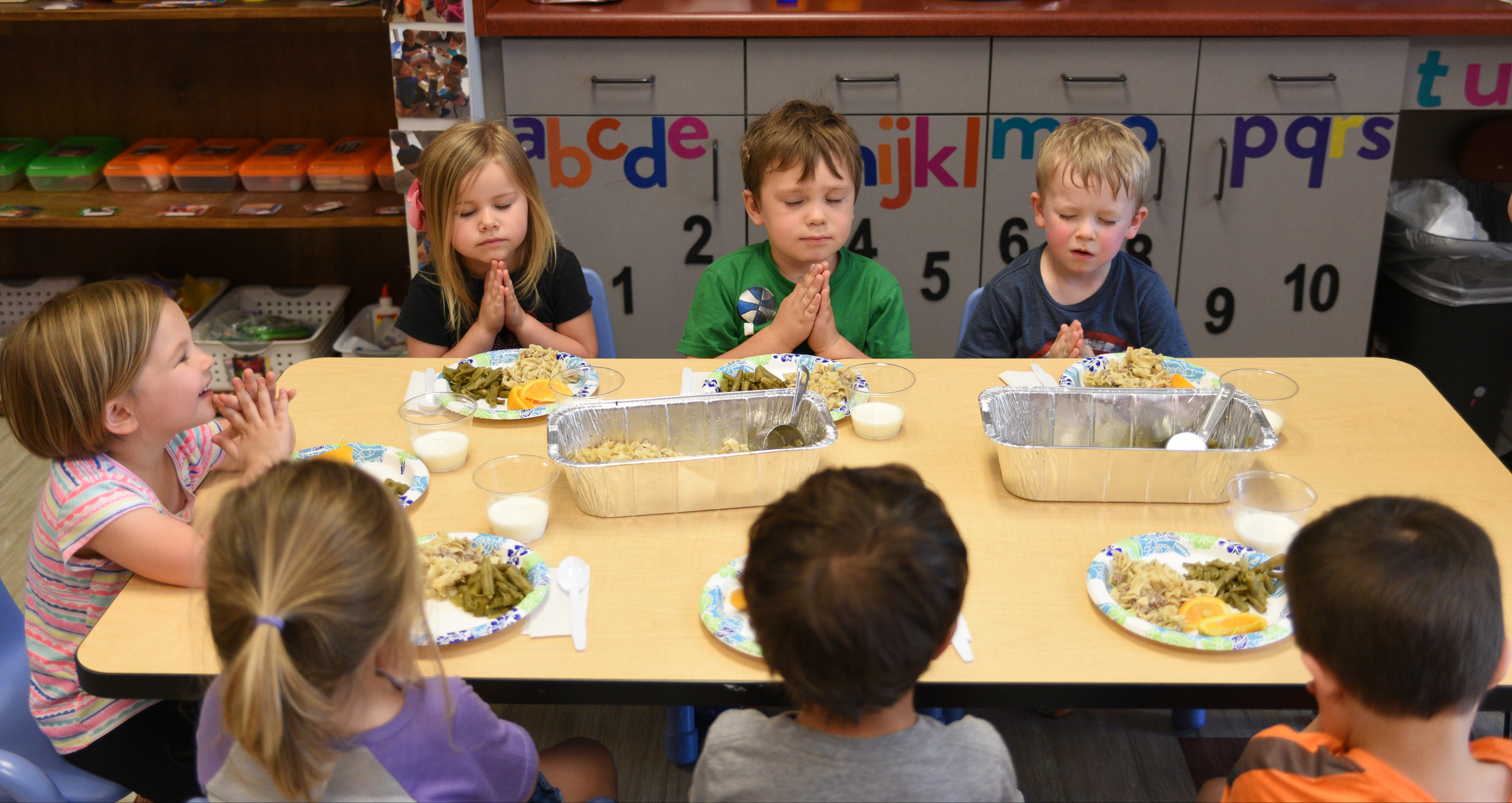 Members of the Buttercup class pray before lunch Wednesday, May 03, 2017 at Hixson United Methodist Church Child Development Center. The church is celebrating the 50th anniversary of their Child Development Center.