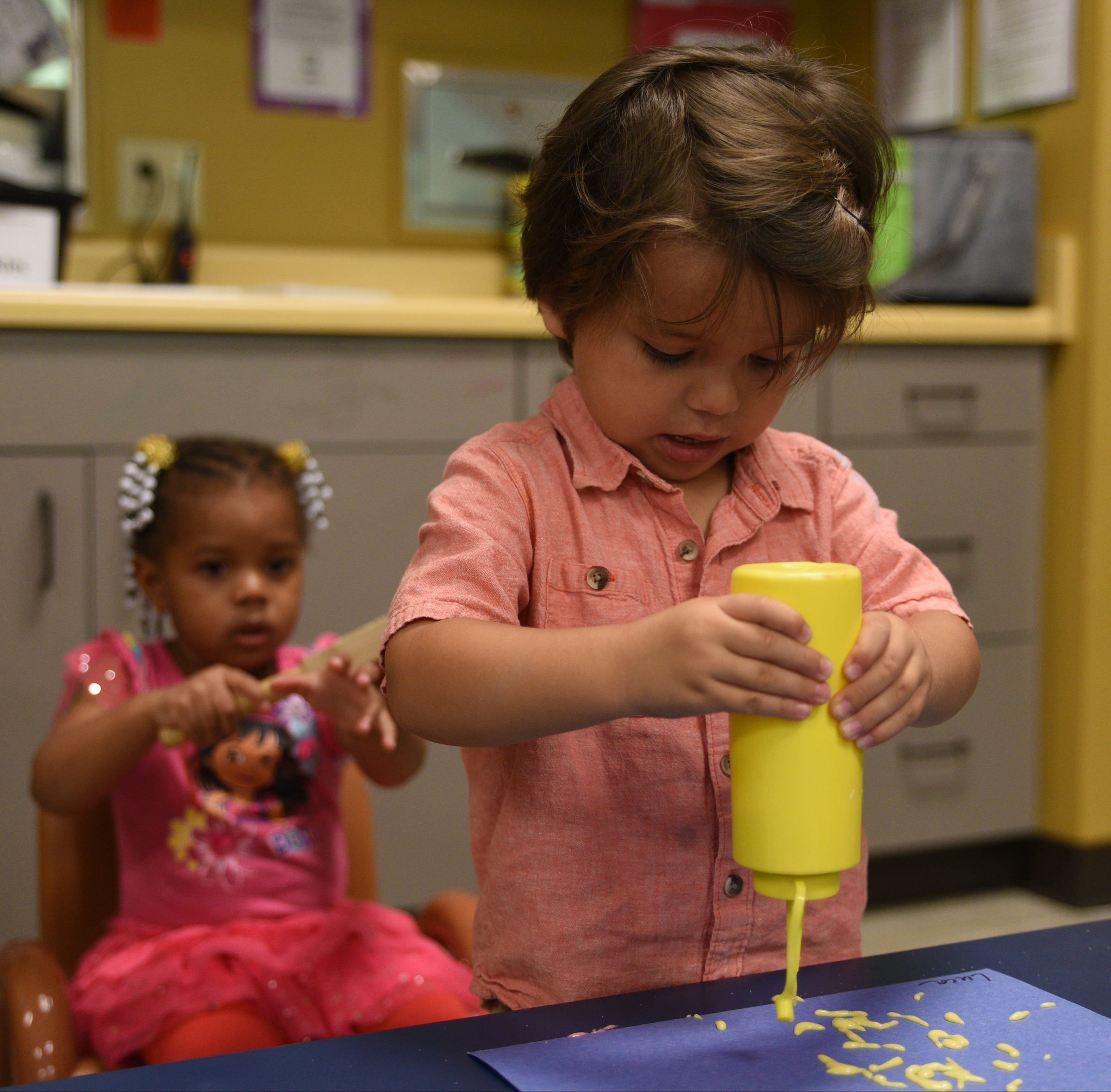Luca Mazariegos, right, works on his artwork as Batiyah Waller plays Wednesday, May 03, 2017 at Hixson United Methodist Church Child Development Center. The church is celebrating the 50th anniversary of their Child Development Center.