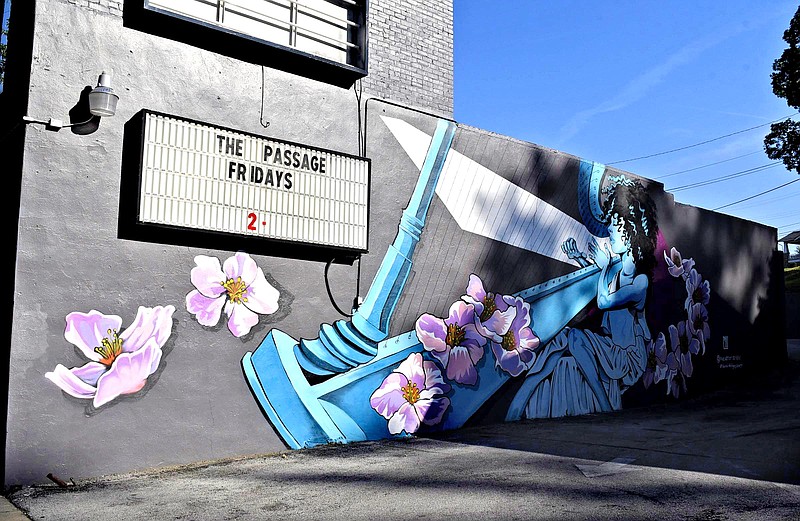 A large mural by The Artist Seven decorates the side of building along Brainerd Road near the McCallie Tunnel. The large-scale painting is part of the artist's Burnin' Bridges Mural Project, winner of an ArtsBuild Equity in the Arts grant.