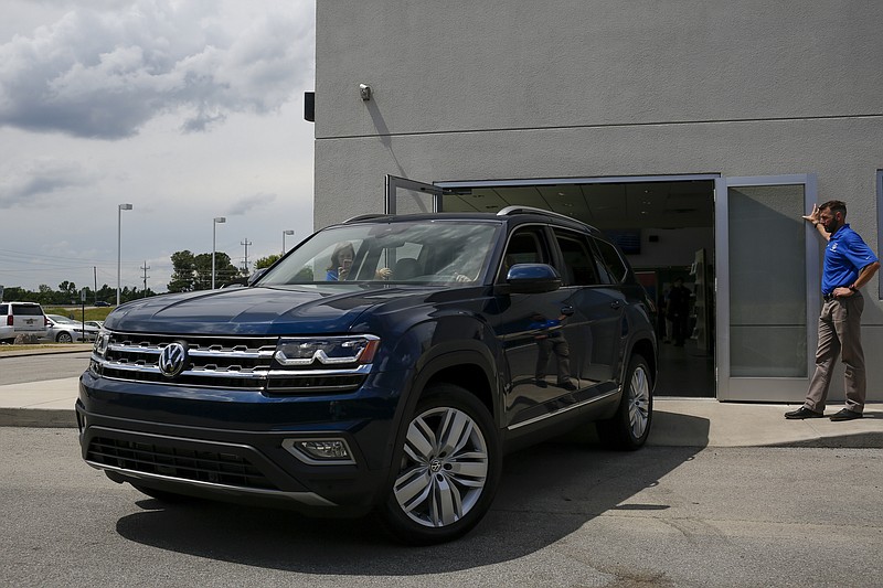 The first Volkswagen Atlas to be purchased drives out of the showroom at Village Volkswagen on Thursday, May 18, 2017, in Chattanooga, Tenn. Tennessee gubernatorial candidate Randy Boyd purchased the first Chattanooga-made Atlas.