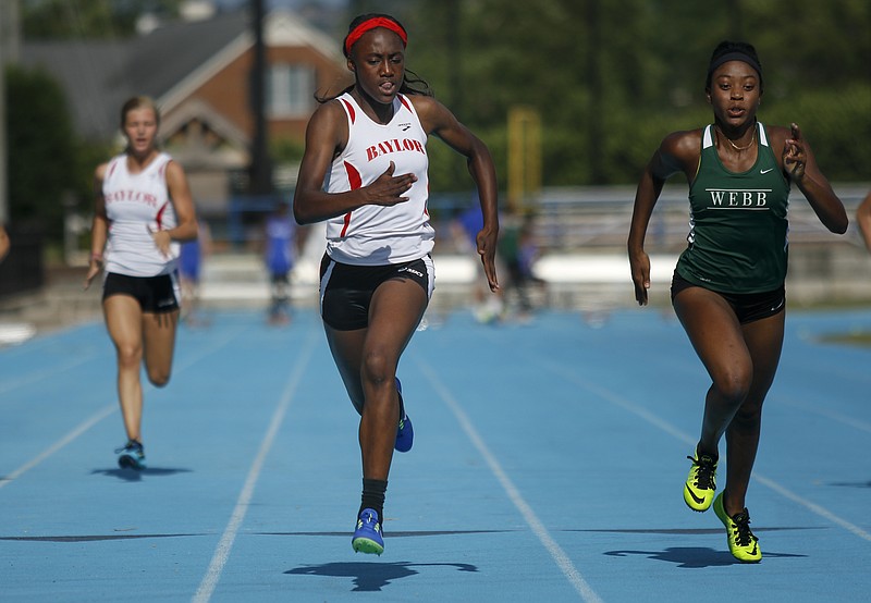 Baylor's Makayla Packer, center, edges past Webb's Jasmine Jefferson during the Division II-AA East region meet Thursday at GPS. Packer won two individual titles and anchored two first-place relay teams as the Lady Red Raiders won the team title.