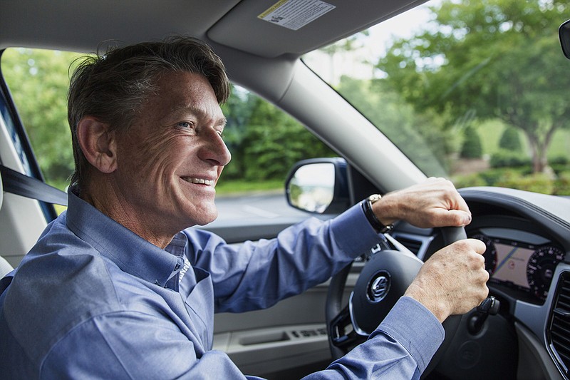 
              Republican gubernatorial candidate Randy Boyd drives in Chattanooga, Tenn., Thursday, May 18, 2017, after taking the first delivery of Volkswagen's new Atlas SUV. Boyd put a deposit down for the new SUV when he was the state's economic development commissioner in 2015. (AP Photo/Erik Schelzig)
            
