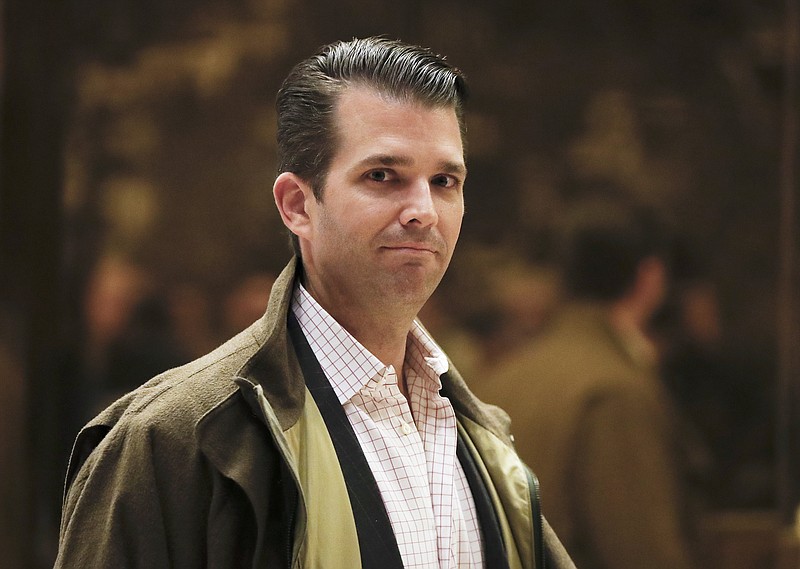 
              FILE -- In this Nov. 16, 2016 file photo, Donald Trump Jr., son of then President-elect Donald Trump, walks from the elevator at Trump Tower, in New York. Trump Jr. traveled recently to Dubai to discuss “new ideas” with a billionaire business partner and give a commencement address at a private university. An Instagram picture posted Tuesday, May 16, 2017 showed Trump with Hussain Sajwani, the chairman of DAMAC Properties, who built one Trump golf course and plans a second in Dubai. (AP Photo/Carolyn Kaster, File)
            